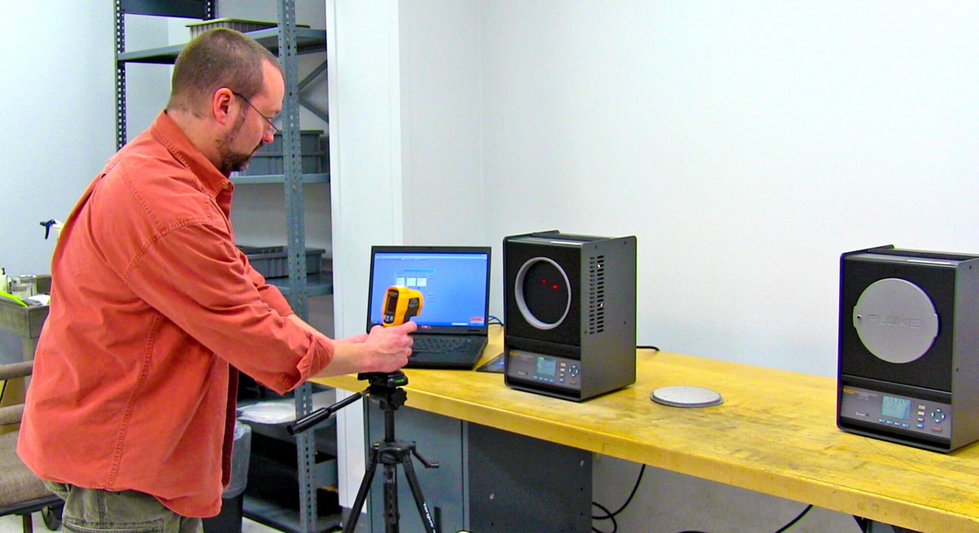 A LTI Technician testing the temperature calibration of a product.